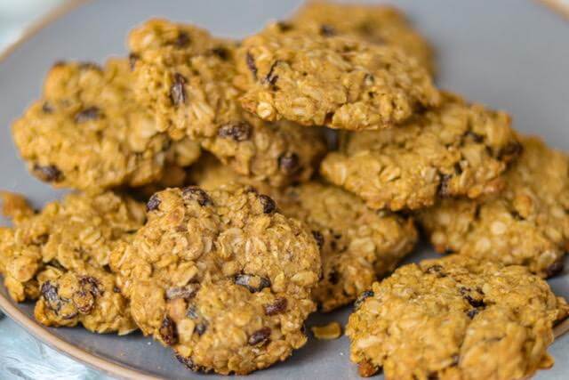 a plate full of oatmeal raisin cookies