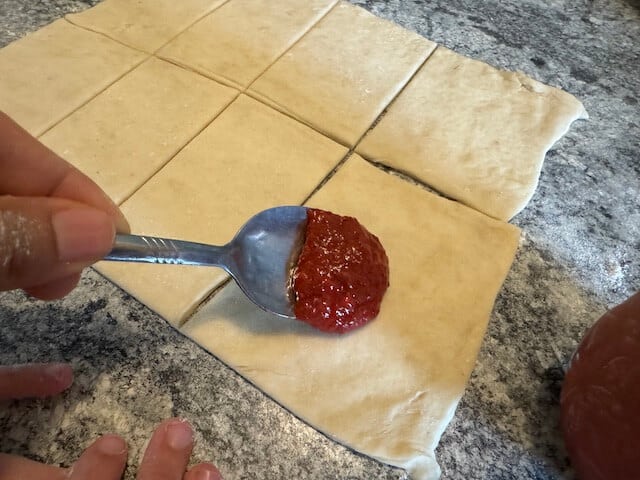 spoon with stawberry filling Sourdough pop tarts dough